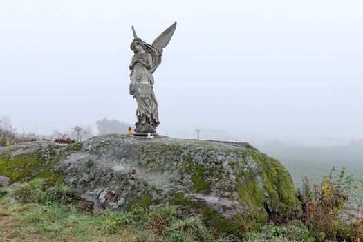 Lone statue of an angel in the fields, Czech Republic