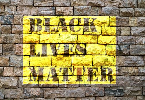 Black Lives Matter slogan liberation banner designs yellow stencil Old brick wall background texture stone