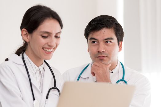 Two doctors have working together with happiness in the hospital.