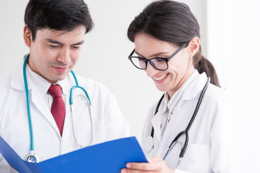 Two doctors have working together with happiness in the hospital.