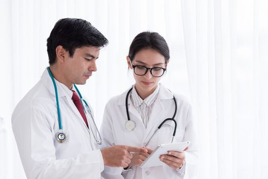 Two doctors have working together with happiness in the hospital.