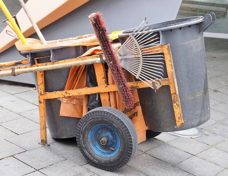 Cart of a street cleaner with different tools