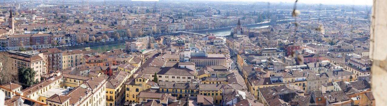 Panoramic view of the historic center of Verona, via a net in the window of the Torre dei Lamberti tower, in Verona, Veneto, Italy