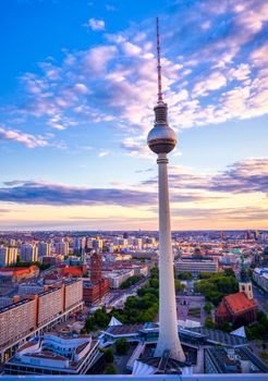 A view of the television tower (Fernsehturm) over the city of Berlin, Germany at sunset.