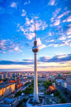 A view of the television tower (Fernsehturm) over the city of Berlin, Germany at sunset.