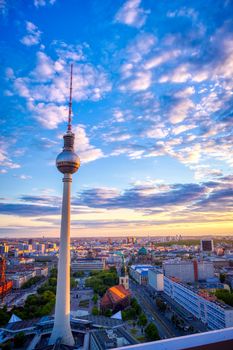 A view of the television tower (Fernsehturm) over the city of Berlin, Germany at sunset.