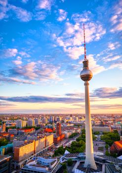 A view of the television tower (Fernsehturm) over the city of Berlin, Germany at sunset.