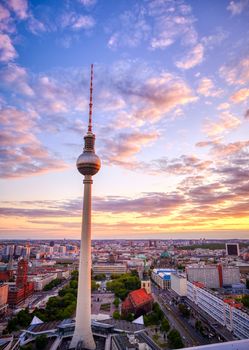 A view of the television tower (Fernsehturm) over the city of Berlin, Germany at sunset.