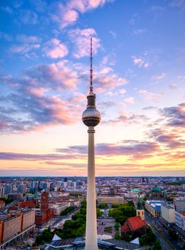 A view of the television tower (Fernsehturm) over the city of Berlin, Germany at sunset.