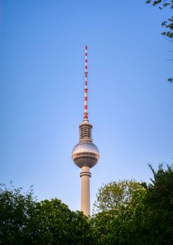 A view of the television tower (Fernsehturm) over the city of Berlin, Germany at sunset.