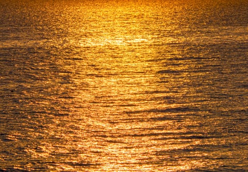 Early morning, dramatic gold sunrise over sea