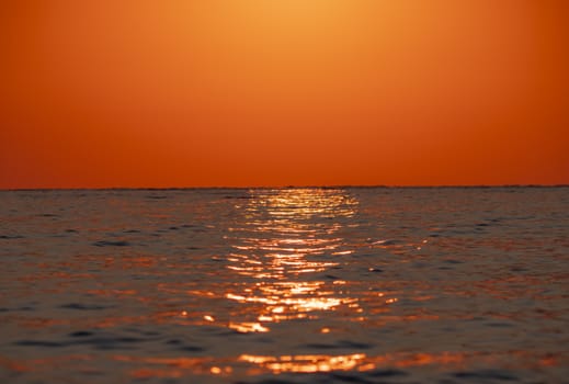 Early morning, dramatic gold sunrise over sea