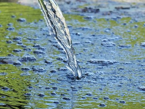 Closeup of water with bubbles in a fountain