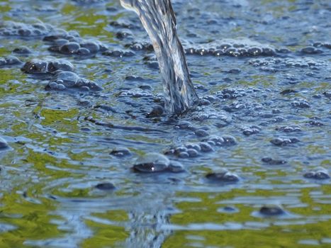 Closeup of water with bubbles in a fountain