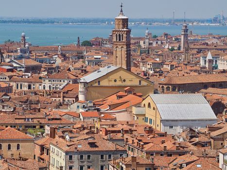 Looking over the red roofs of Venice from the Campanile in direction tower Santo Stefano