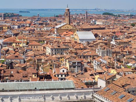 Looking over the red roofs of Venice from the Campanile in direction tower Santo Stefano