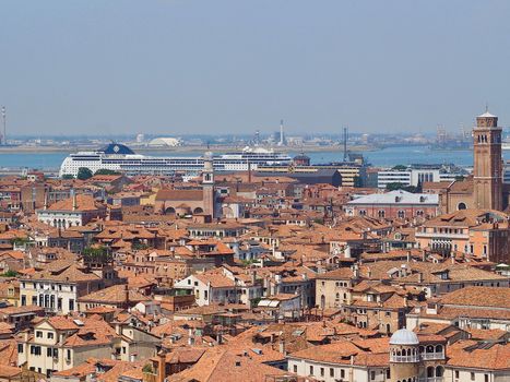 Looking over the red roofs of Venice from the Campanile in direction tower Santo Stefano