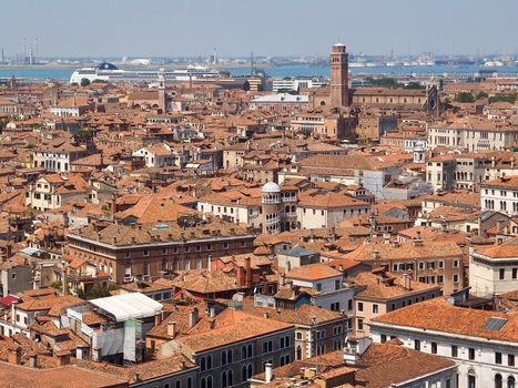 Looking over the red roofs of Venice from the Campanile in direction tower Santo Stefano