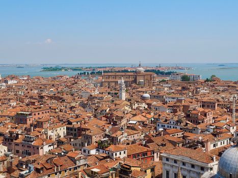 Looking over the red roofs of Venice from the Campanile in direction tower Santo Stefano