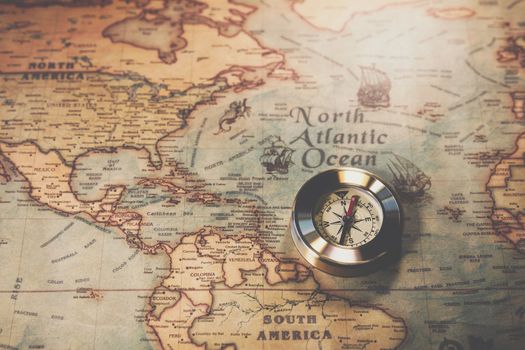 Columbus day and world map with compass