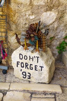 A war memorial with typical bullet souvenirs on sale in Mostar, Bosnia and Herzegovina