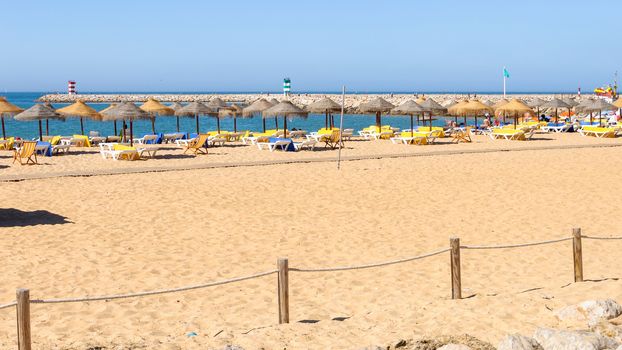 Sandy beach at Atlantic Ocean in Vilamoura, Algarve, Portugal