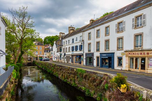 Pont-Aven, France - April 28, 2017: Idyllic scenery at Pont-Aven, street view with small shops, commune in the Finistere department of Brittany (Bretagne) in northwestern France