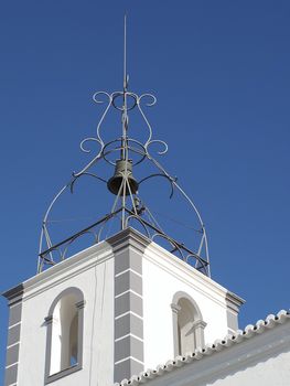 White bell tower church in Albufeira at the Algarve coast of Portugal