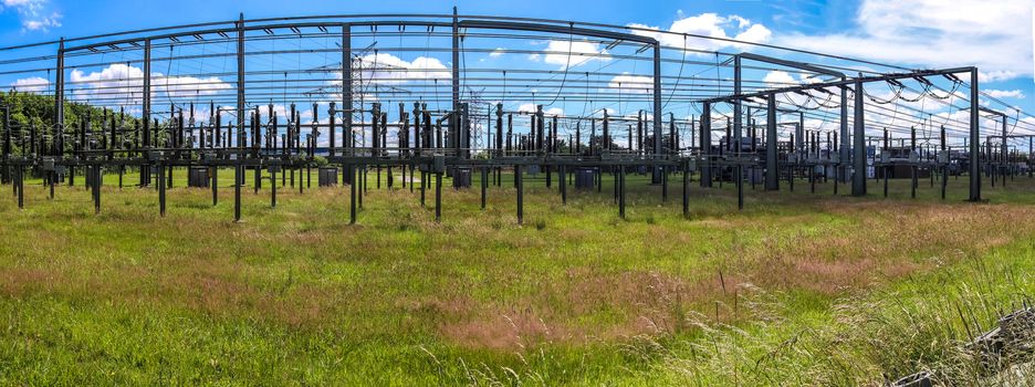 Electrical Transformer. Distribution of electric energy at a big substation with lots power lines