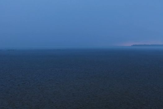 A downpour over the water surface of the overlook. The gurgles of water. Water splashes and drops.