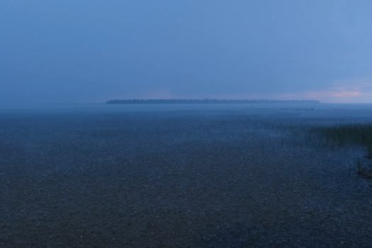 A downpour over the water surface of the overlook. The gurgles of water. Water splashes and drops.