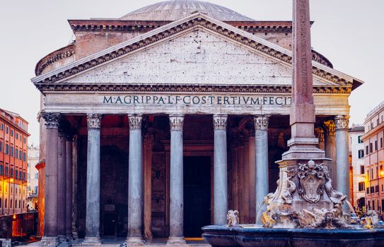 Pantheon, former Roman temple of all gods, now a church, and Fountain with obelisk at Piazza della Rotonda. Rome, Italy