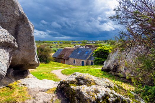 House between the rocks in Meneham village, Kerlouan, Finistere, Brittany (Bretagne), France