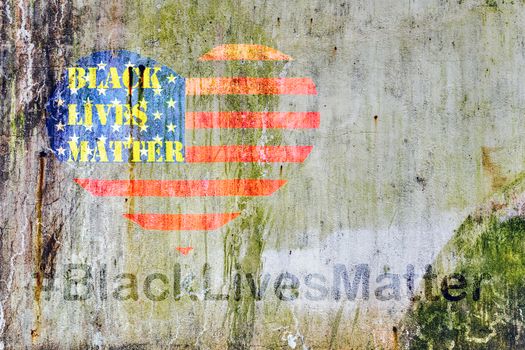 Black Lives Matter hashtag text liberation banner designs stencil heart flag of the United States of America city street of a old concrete white wall