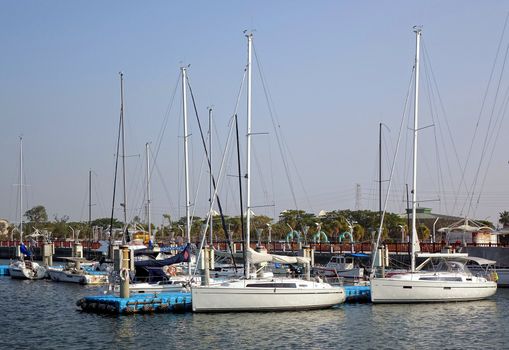 SINDA PORT, TAIWAN -- DECEMBER 14, 2014: Luxurious sailing yachts are anchored at Lover's Wharf in the port of Sinda.