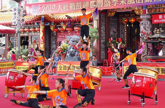 KAOHSIUNG, TAIWAN -- MAY 26, 2019: A junior high school percussion group performs at the Qing Yun Temple in the Dashe District of Kaohsiung City.
