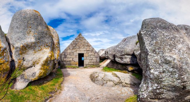House between the rocks in Meneham village, Kerlouan, Finistere, Brittany (Bretagne), France