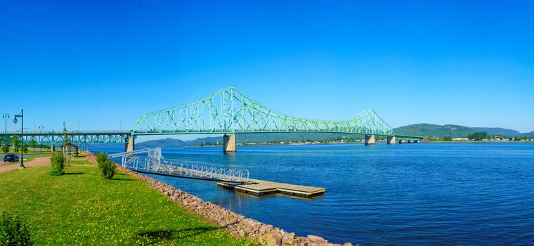 Panoramic view of the J.C. Van Horne Bridge, crossing the Restigouche River between Campbellton, New Brunswick and Pointe-a-la-Croix, Quebec. Canada