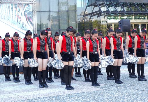KAOHSIUNG, TAIWAN -- JUNE 17, 2015: Students from the Shu-Te High School perform a free outdoor dance for the start of the Dragon Boat Festival.
