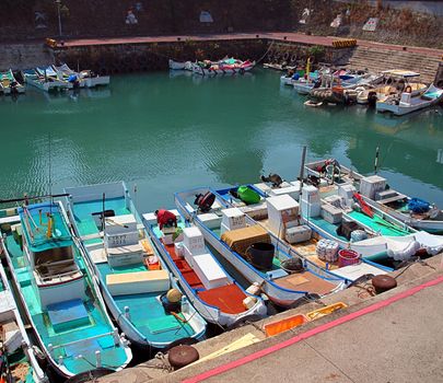 LIUQIU, TAIWAN -- SEPTEMBER 23:  Small fishing boats on the island of Liuqiu seek refuge in port to take shelter from the  approaching typhoon Usagi, on September 23, 2014 in Liuqiu.