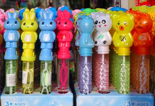 KAOHSIUNG, TAIWAN -- DECEMBER 14, 2019: A street vendor sells colorful toys used to make soap bubbles.