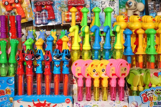 KAOHSIUNG, TAIWAN -- DECEMBER 14, 2019: A street vendor sells colorful toys used to make soap bubbles.

