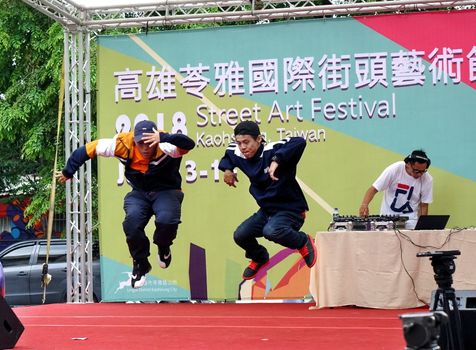 KAOHSIUNG, TAIWAN -- JULY 14, 2017: Two male dancers participate in the hip-hop competition at the 2018 Street Art Festival.