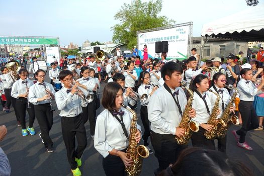 KAOHSIUNG, TAIWAN -- OCTOBER 1, 2017: A student marching band joins a street parade at the opening of the 2017 Ecomobility Festival.