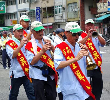 KAOHSIUNG, TAIWAN -- JULY 9, 2016: Participants in a Daoist religious ceremony play the Suona, a traditional Chinese wind instrument.
