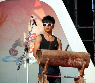 KAOHSIUNG, TAIWAN - FEBRUARY 23: A native Taiwanese drummer performs for the 2013 Kaohsiung Lantern Festival on February 23, 2013 in Kaohsiung.