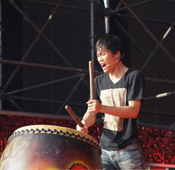 KAOHSIUNG, TAIWAN - FEBRUARY 23: A native Taiwanese drummer performs for the 2013 Kaohsiung Lantern Festival on February 23, 2013 in Kaohsiung.