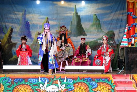 KAOHSIUNG, TAIWAN -- OCTOBER 26, 2018: Taiwan folk opera is performed in an outdoor public space as part of a temple celebration.