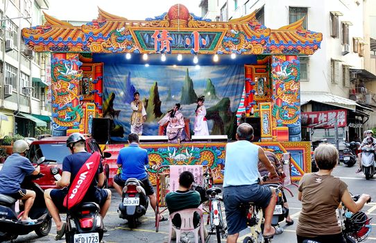 KAOHSIUNG, TAIWAN -- OCTOBER 26, 2018: Taiwan folk opera is performed in an outdoor public space as part of a temple celebration.
