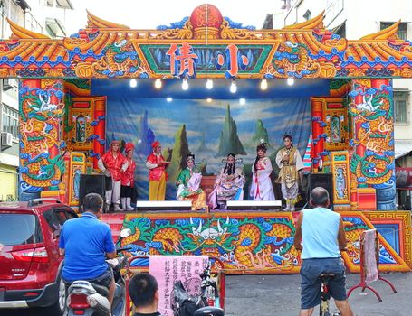 KAOHSIUNG, TAIWAN -- OCTOBER 26, 2018: Taiwan folk opera is performed in an outdoor public space as part of a temple celebration.